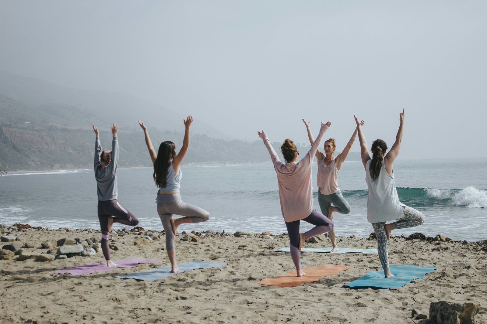 Women practising yoga together